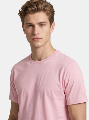 Man wearing a pink t-shirt against a light background