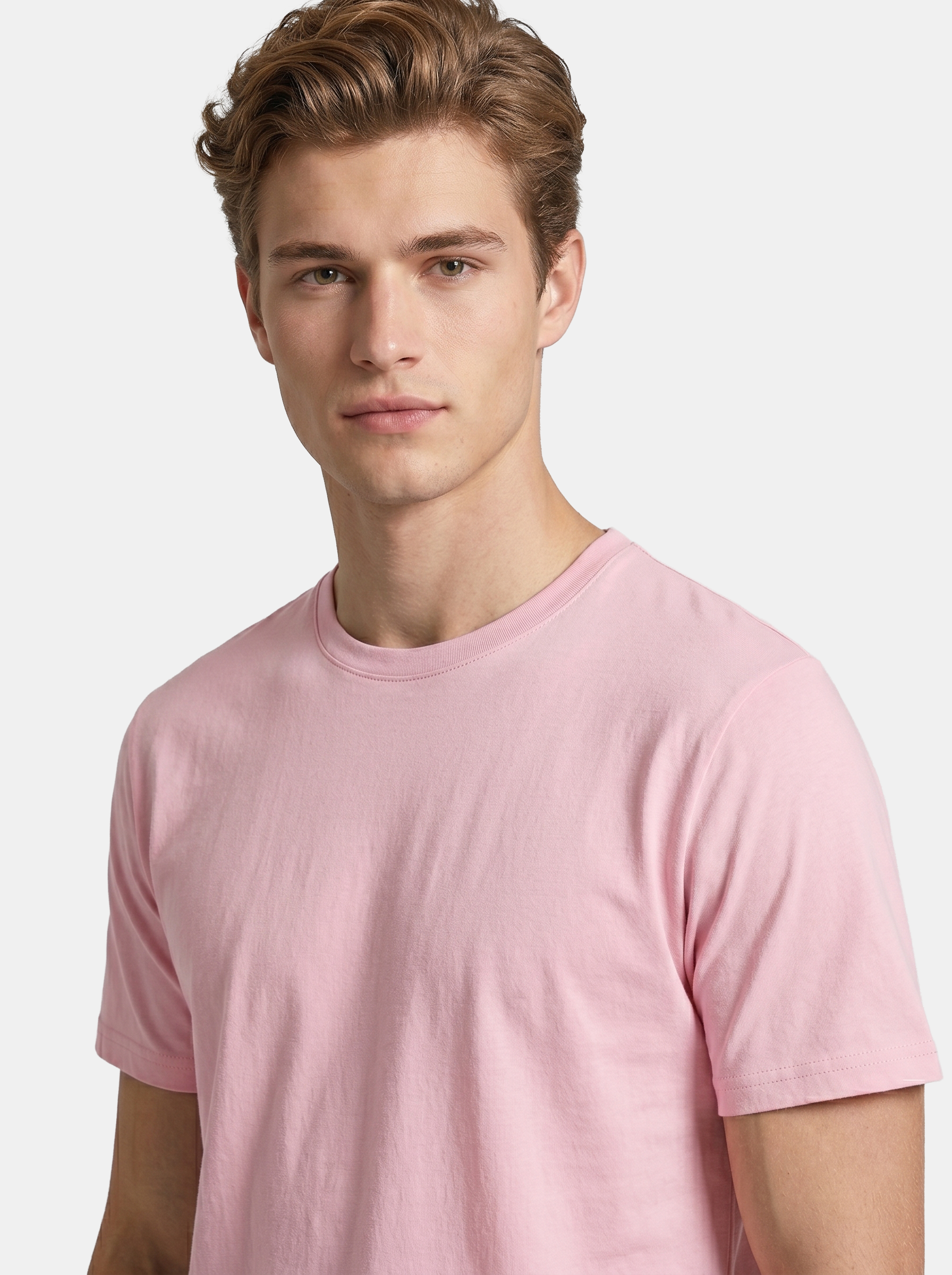 Man wearing a pink t-shirt against a light background
